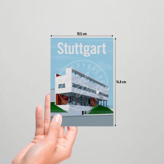 A hand holding a postcard of the Stuttgart Weissenhof Museum on a white background.