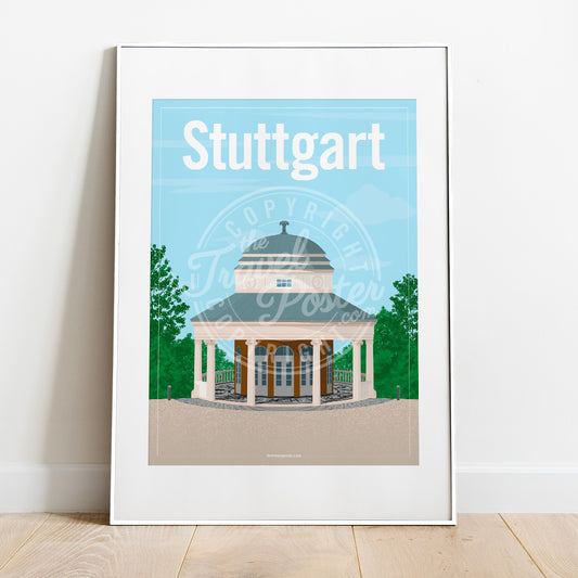 a frame with a poster of the Stuttgart Teehaus, placed on a parquet floor resting against a white wall