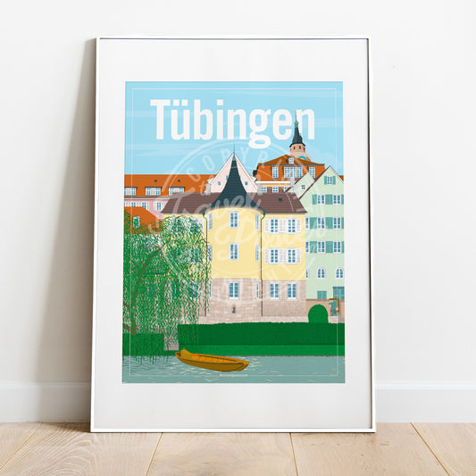 a frame with a poster of the Tübingen Holderlinturm, placed on a parquet floor resting against a white wall
