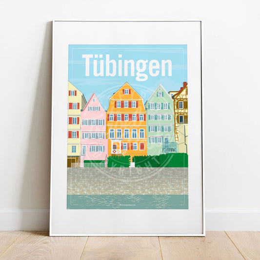 a frame with a poster of the Neckar riverfront in Tübingen, placed on a parquet floor resting against a white wall
