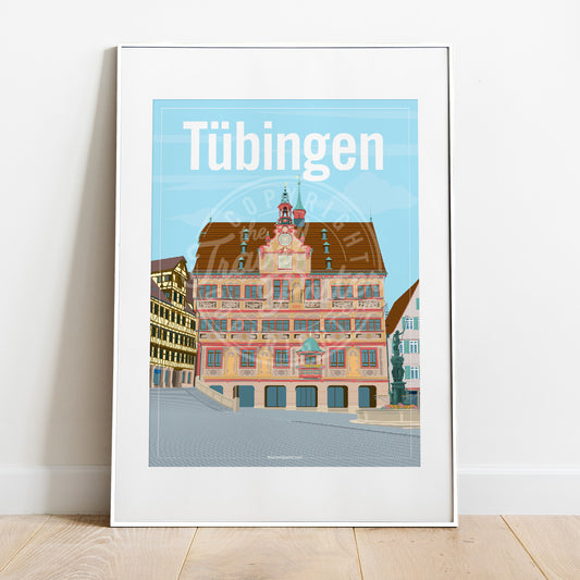 a frame with a poster of the Tübingen Rathaus, placed on a parquet floor resting against a white wall