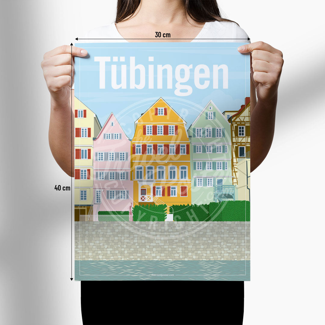 A woman holding a poster of the Neckar riverfront in Tübingen on a white background