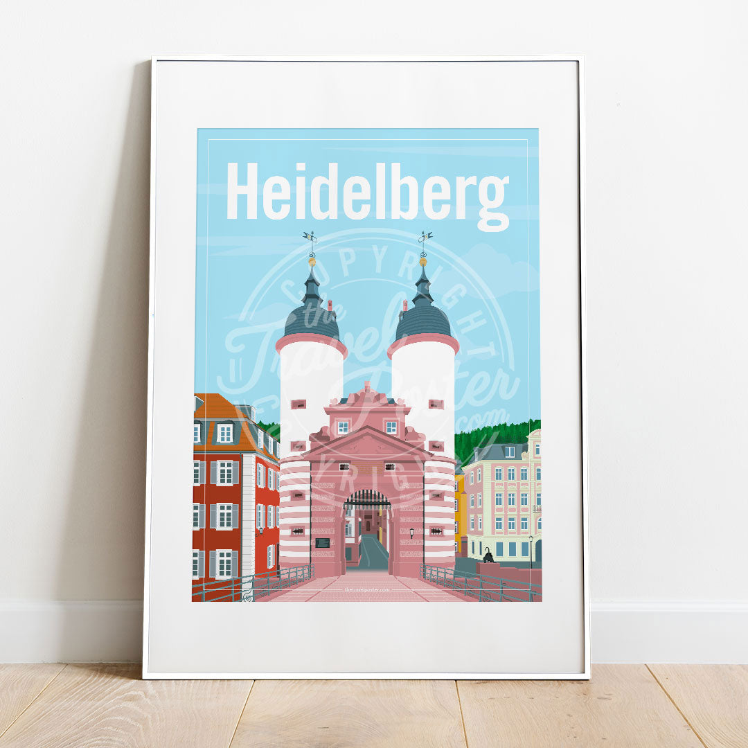 a frame with a poster of the Heidelberg Bridge Gate, placed on a parquet floor resting against a white wall