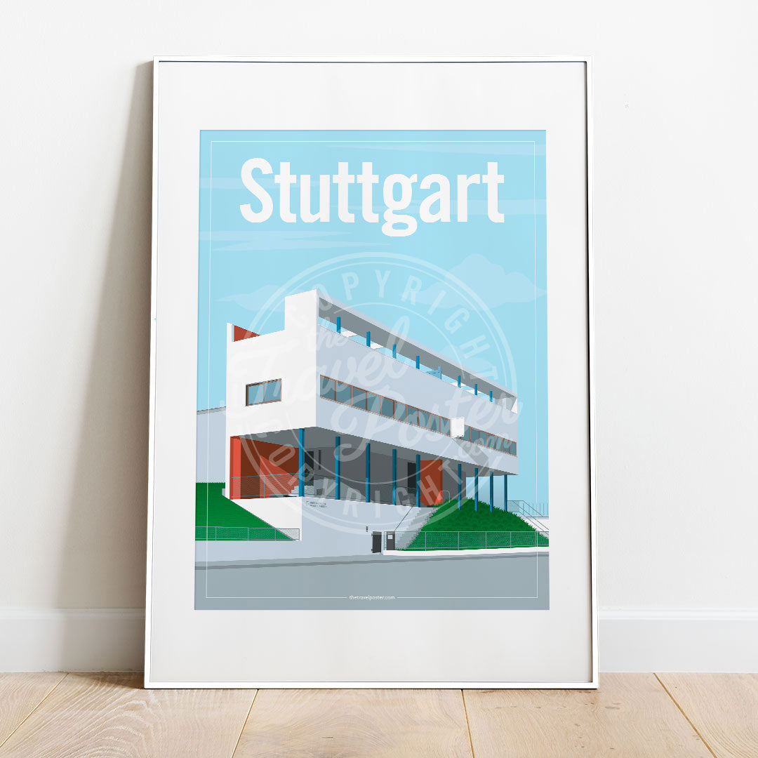 a frame with a poster of the Stuttgart Weissenhof Museum, placed on a parquet floor resting against a white wall