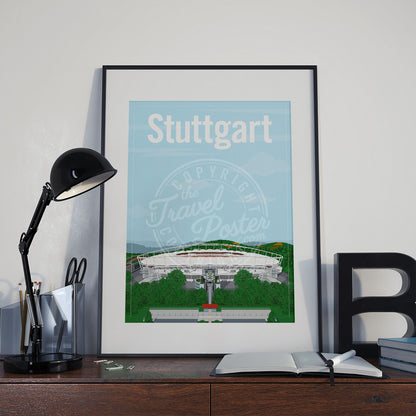a frame with a poster of the Stuttgart Neckarstadion, placed a wooden sideboard with a table lamp and stationery supplies