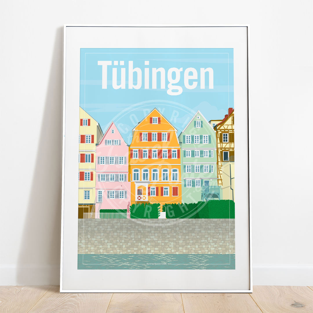 a frame with a poster of the Neckar riverfront in Tübingen, placed on a parquet floor resting against a white wall